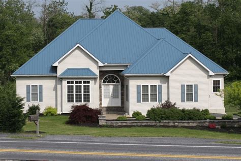 blue house white shutters metal roof|blue roof white house exterior.